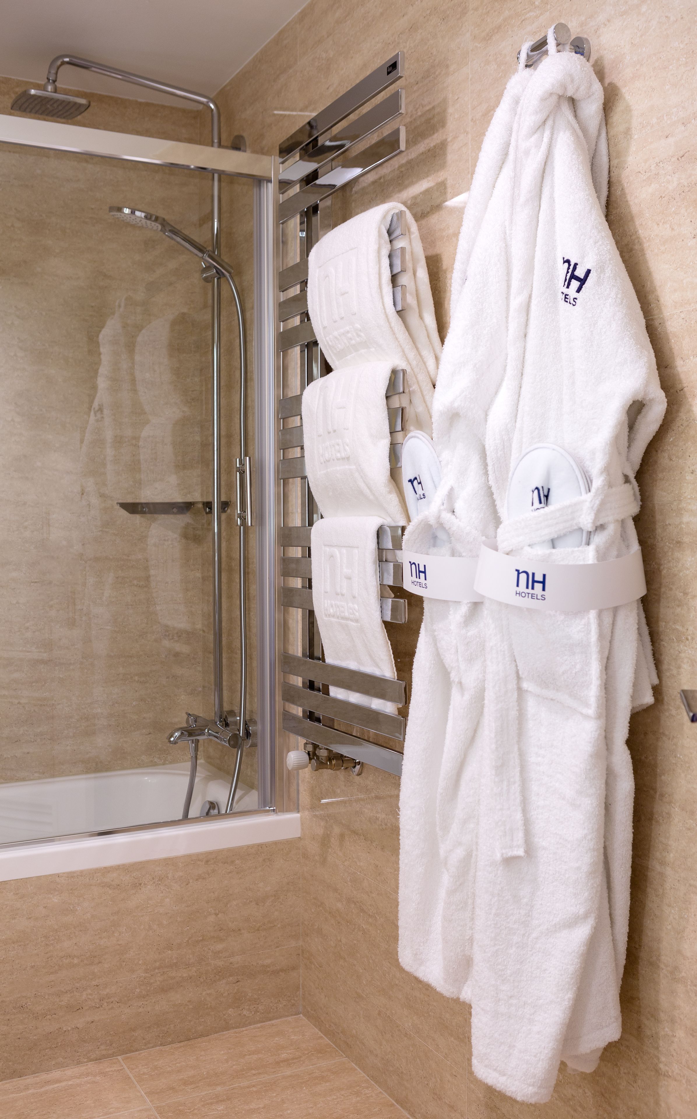 rainfall showerhead, eco-friendly toiletries, hair dryer, towels