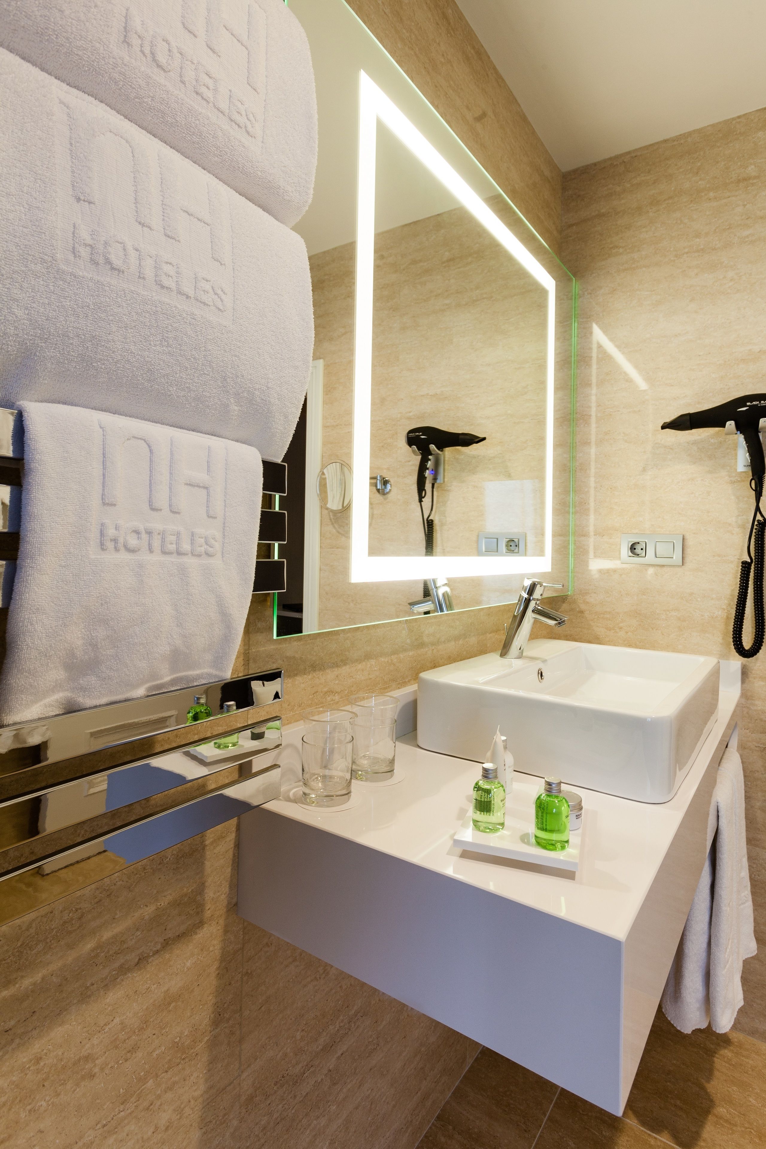 rainfall showerhead, eco-friendly toiletries, hair dryer, towels