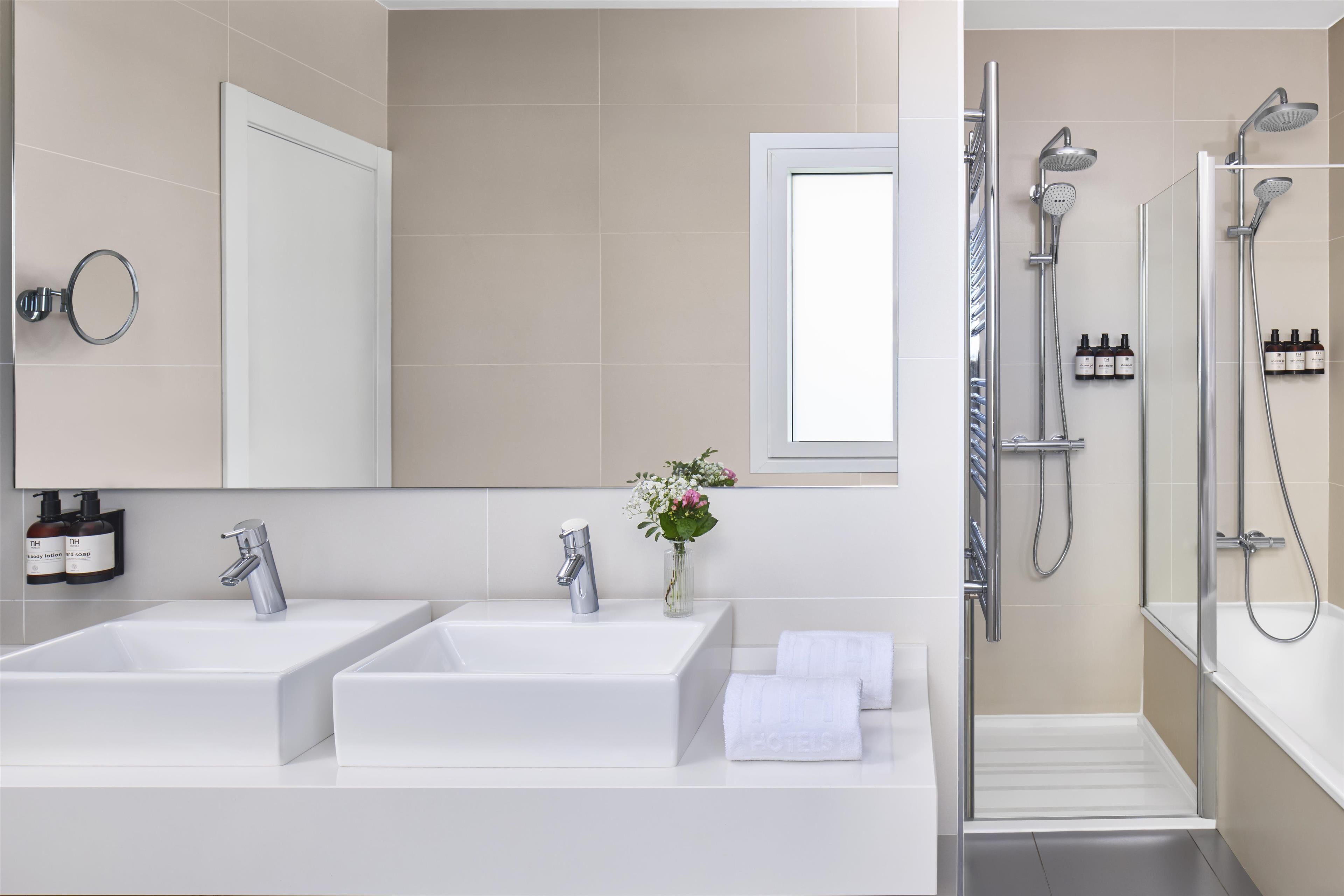 shower, designer toiletries, hair dryer, towels