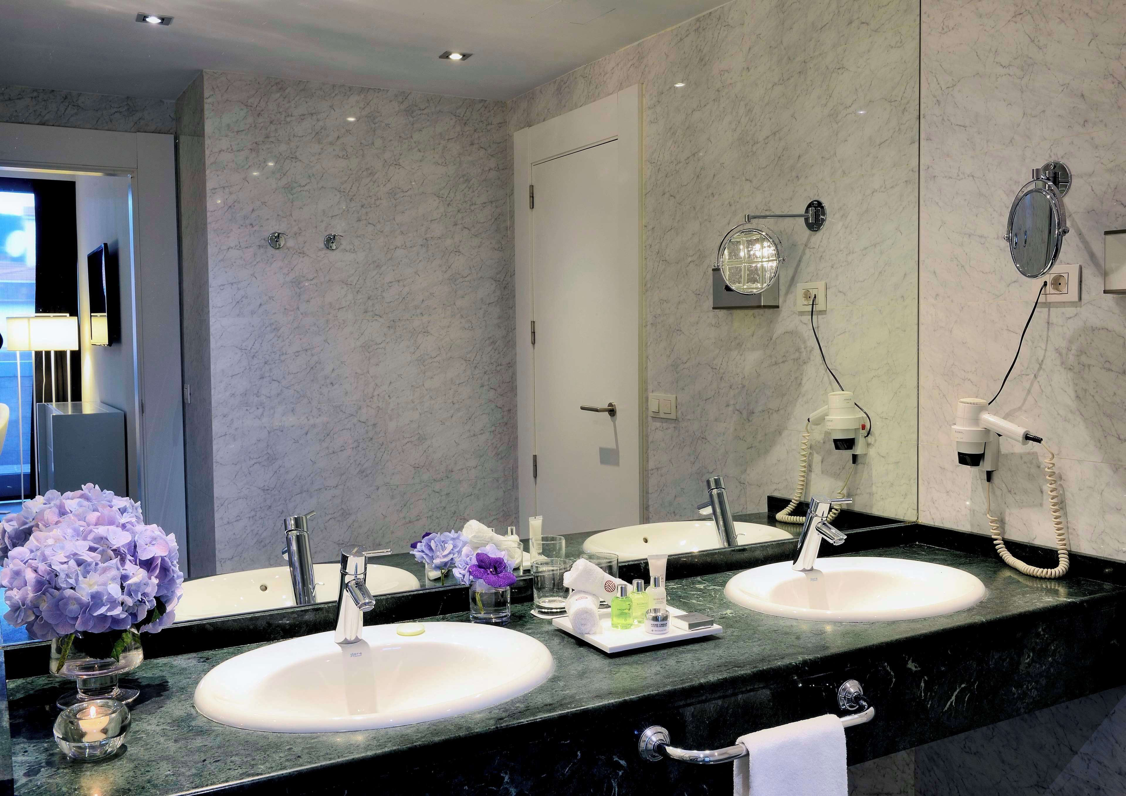 eco-friendly toiletries, hair dryer, towels