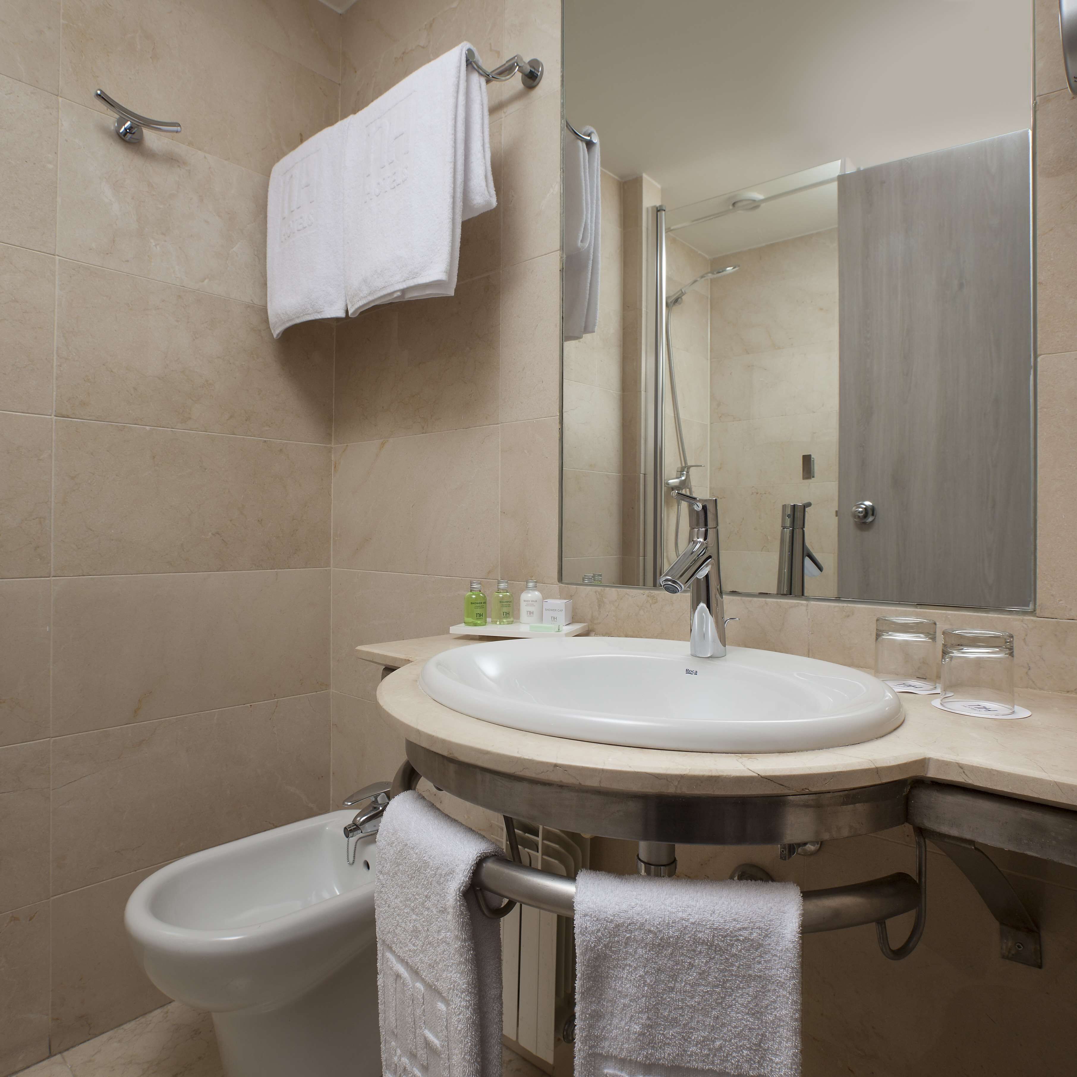 shower, eco-friendly toiletries, hair dryer, towels