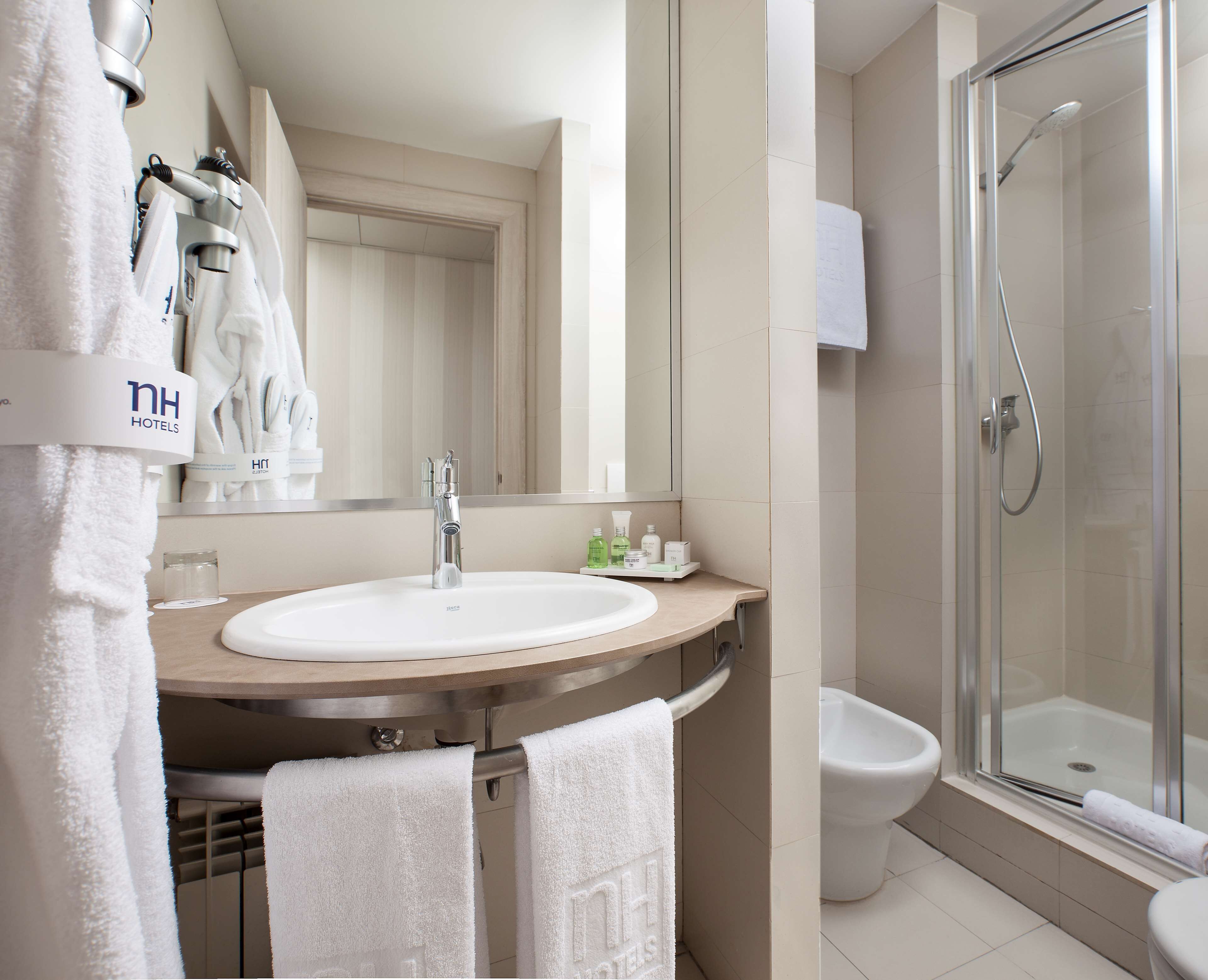 shower, eco-friendly toiletries, hair dryer, towels