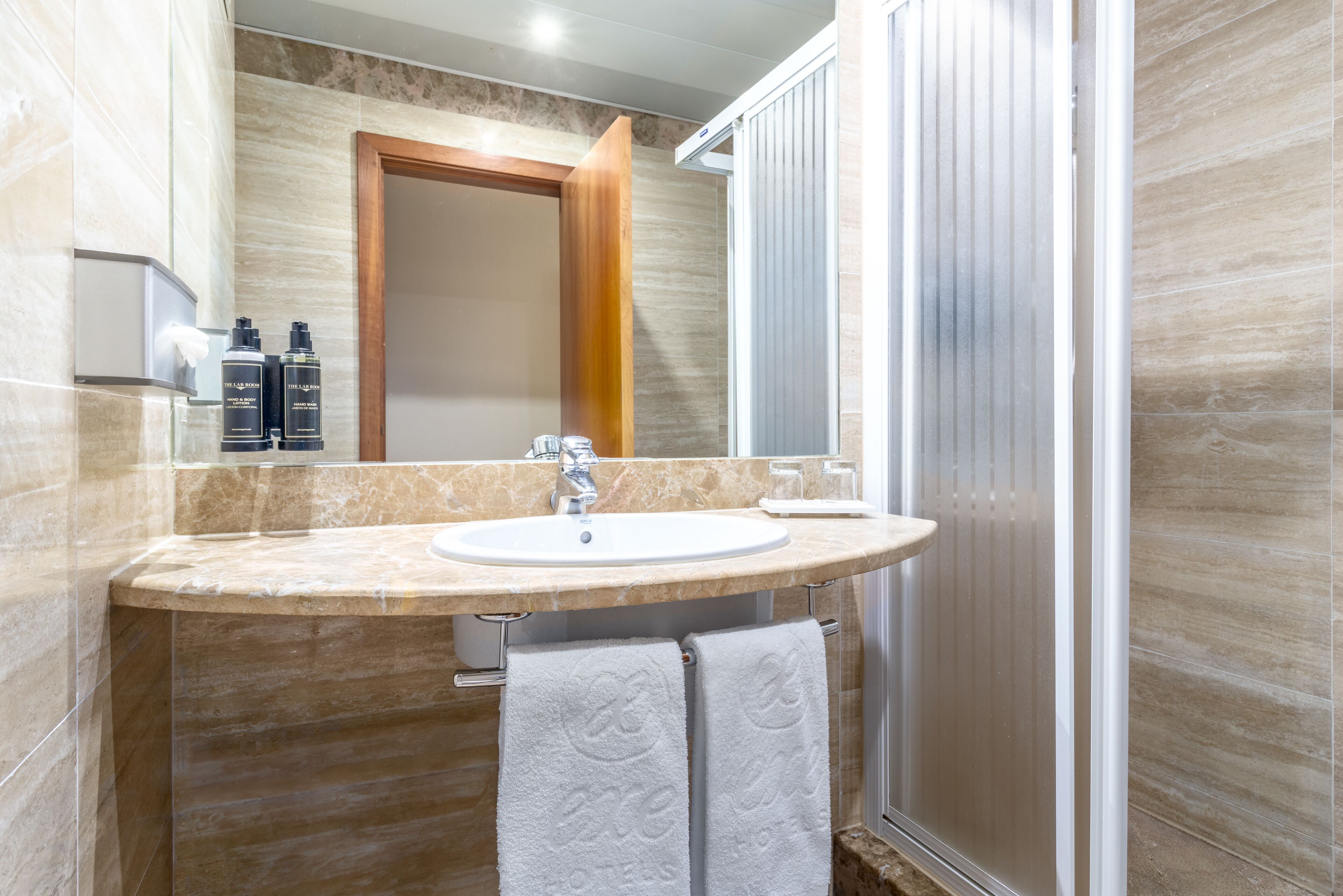 shower, eco-friendly toiletries, hair dryer, towels