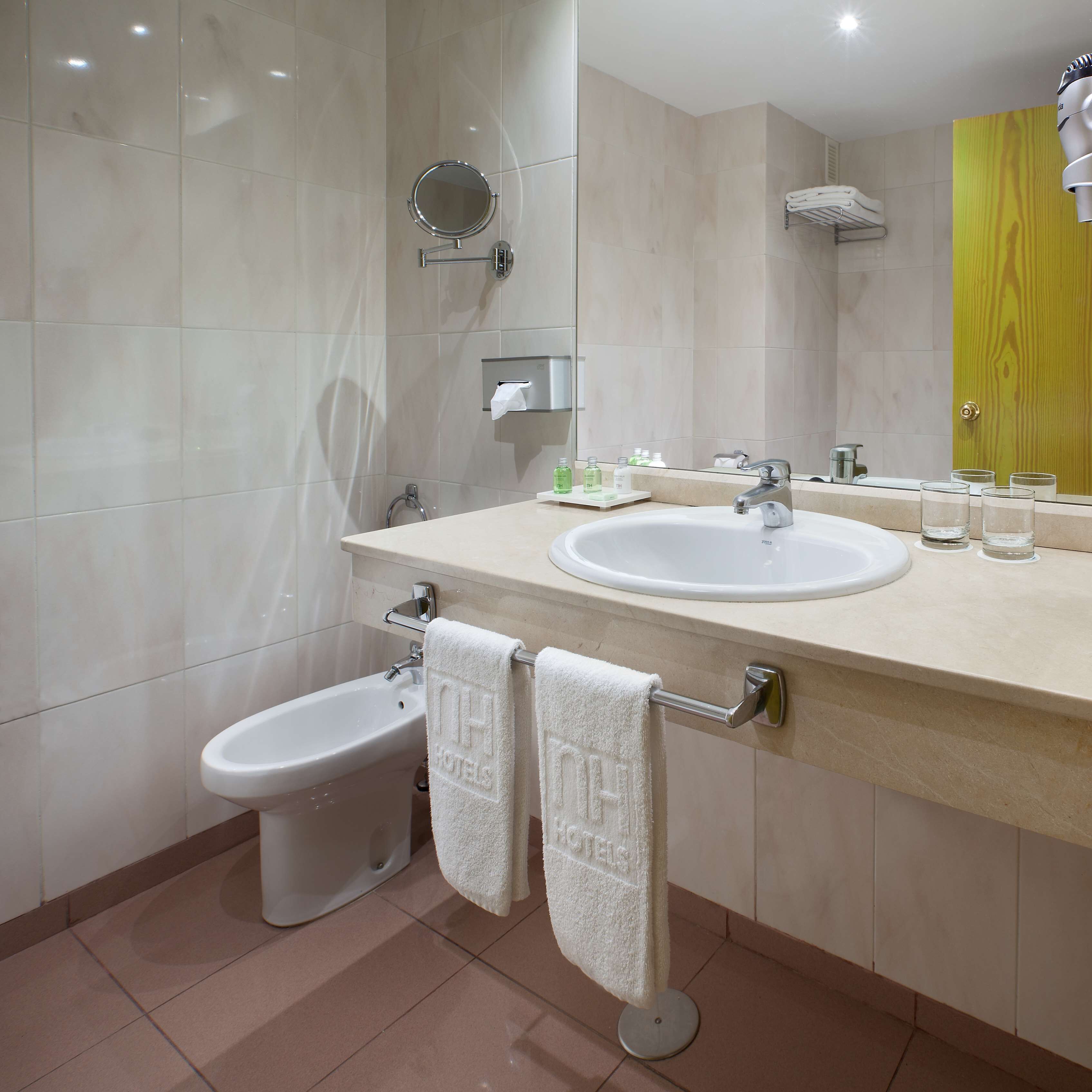 bathtub, eco-friendly toiletries, hair dryer, bidet