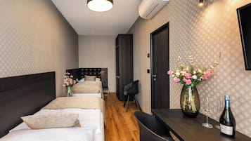 Family Room | Premium bedding, memory foam beds, in-room safe, individually furnished