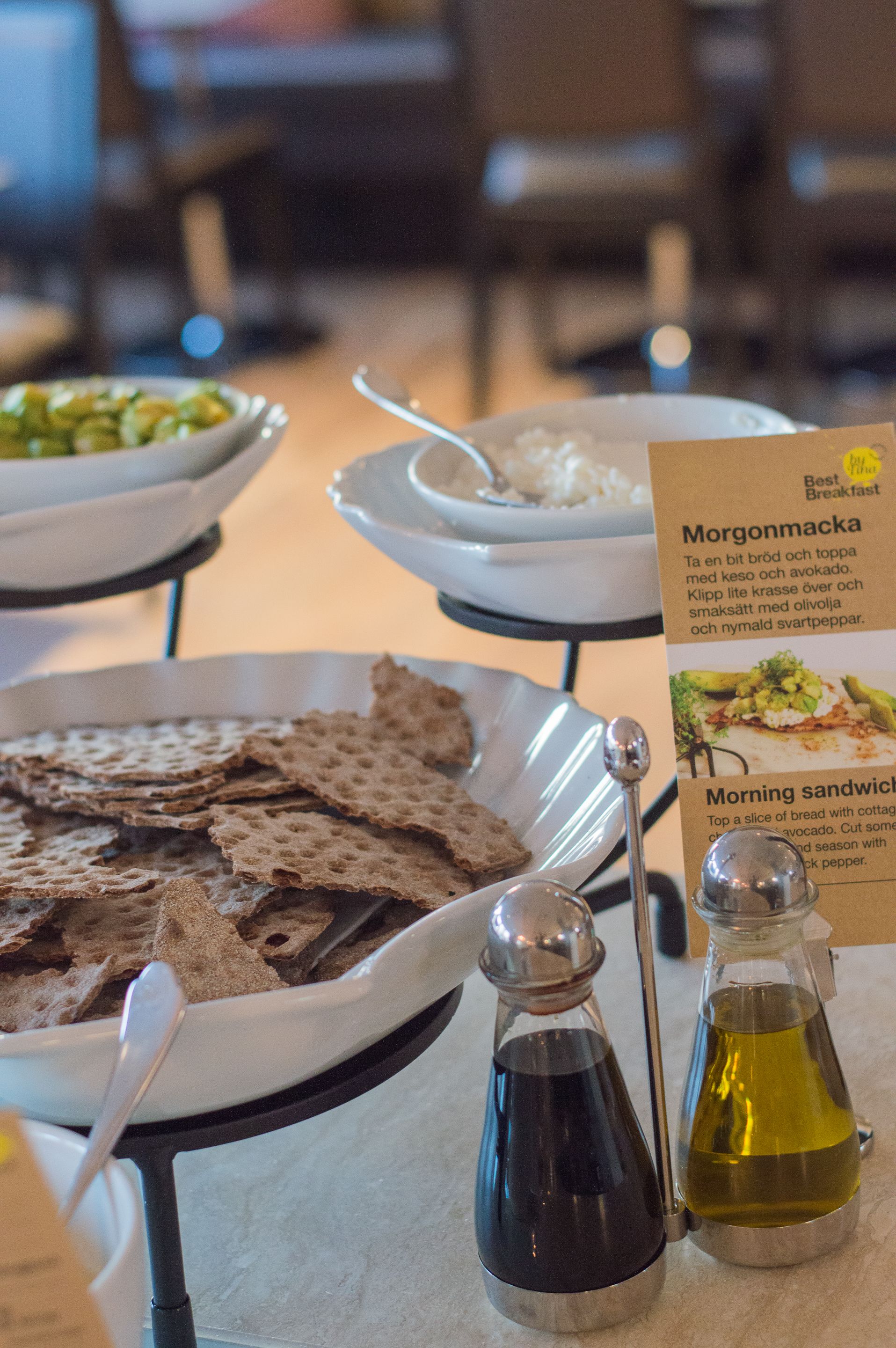 A breakfast buffet with various dishes and condiments.
