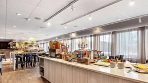 A modern hotel lobby with a long reception desk, bar area, and seating. - Best Western Arlanda Plus Park Airport Hotel (Arlandastad)