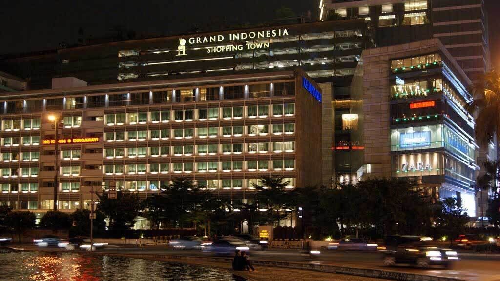 A multi-story hotel with a sign reading "Grand Indonesia Shopping Town."