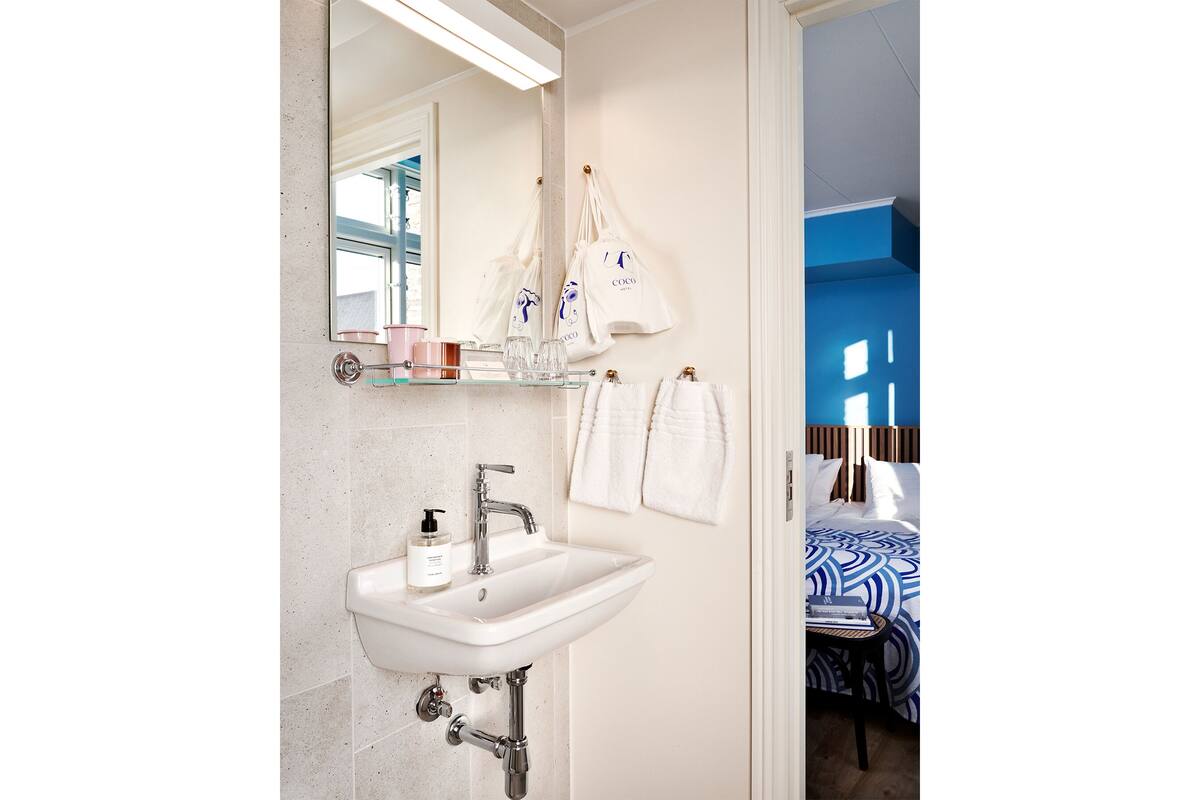 standard double room | bathroom | hair dryer, heated floors, towels, soap