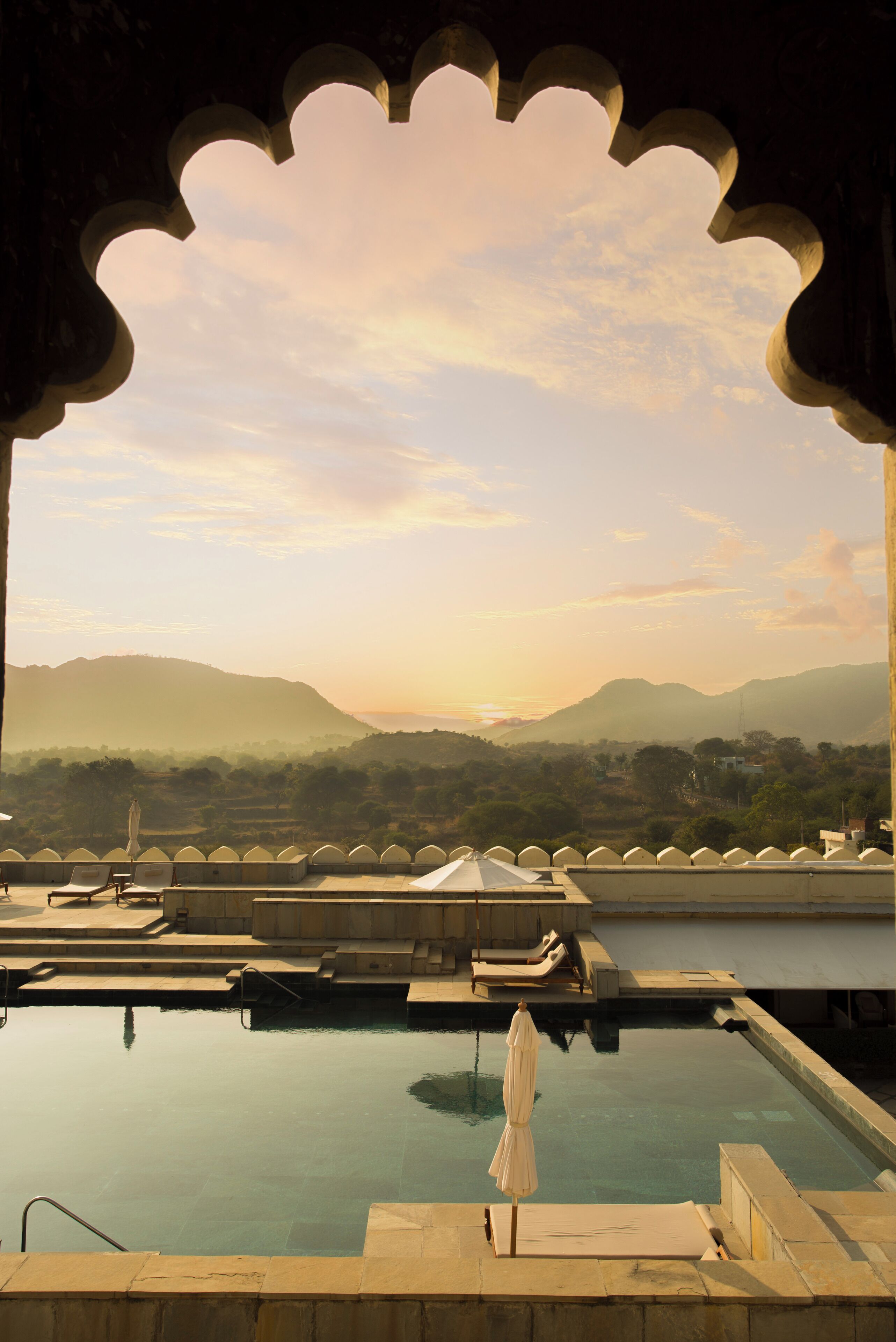 Outdoor pool, open 7:00 AM to 7:00 PM, pool umbrellas, pool loungers