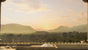 Outdoor pool, open 7:00 AM to 7:00 PM, pool umbrellas, pool loungers