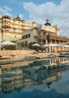 Outdoor pool, open 7:00 AM to 7:00 PM, pool umbrellas, pool loungers