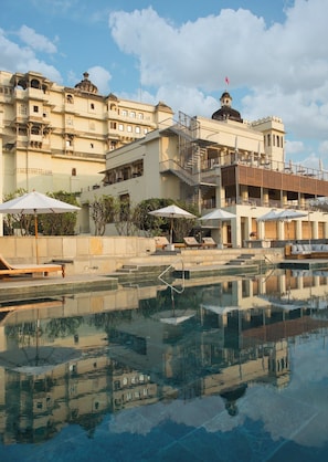 Outdoor pool, open 7:00 AM to 7:00 PM, pool umbrellas, pool loungers
