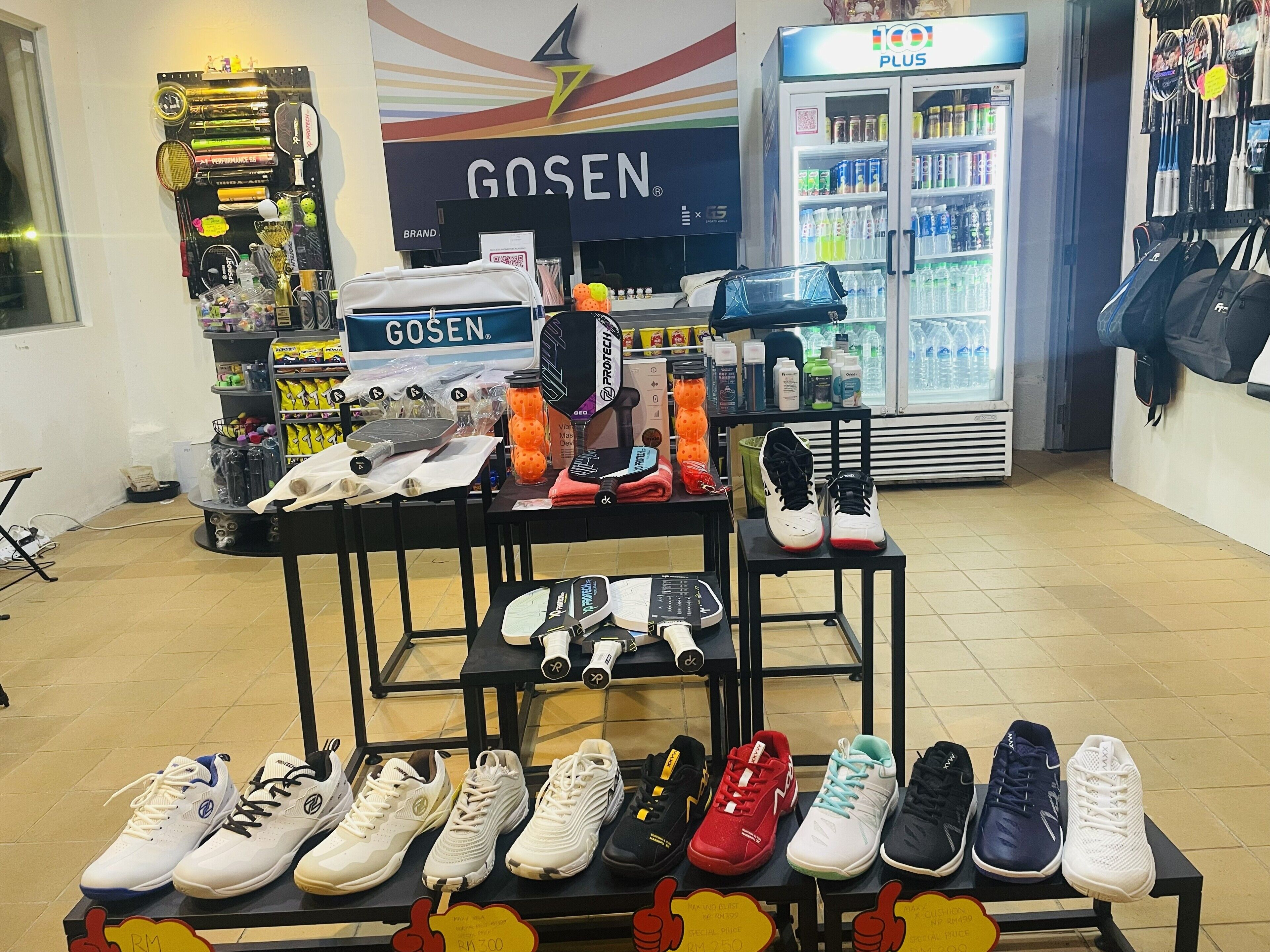 A shoe display with various styles and a GoSen sign in the background.