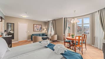 Suite | Premium bedding, desk, laptop workspace, blackout drapes