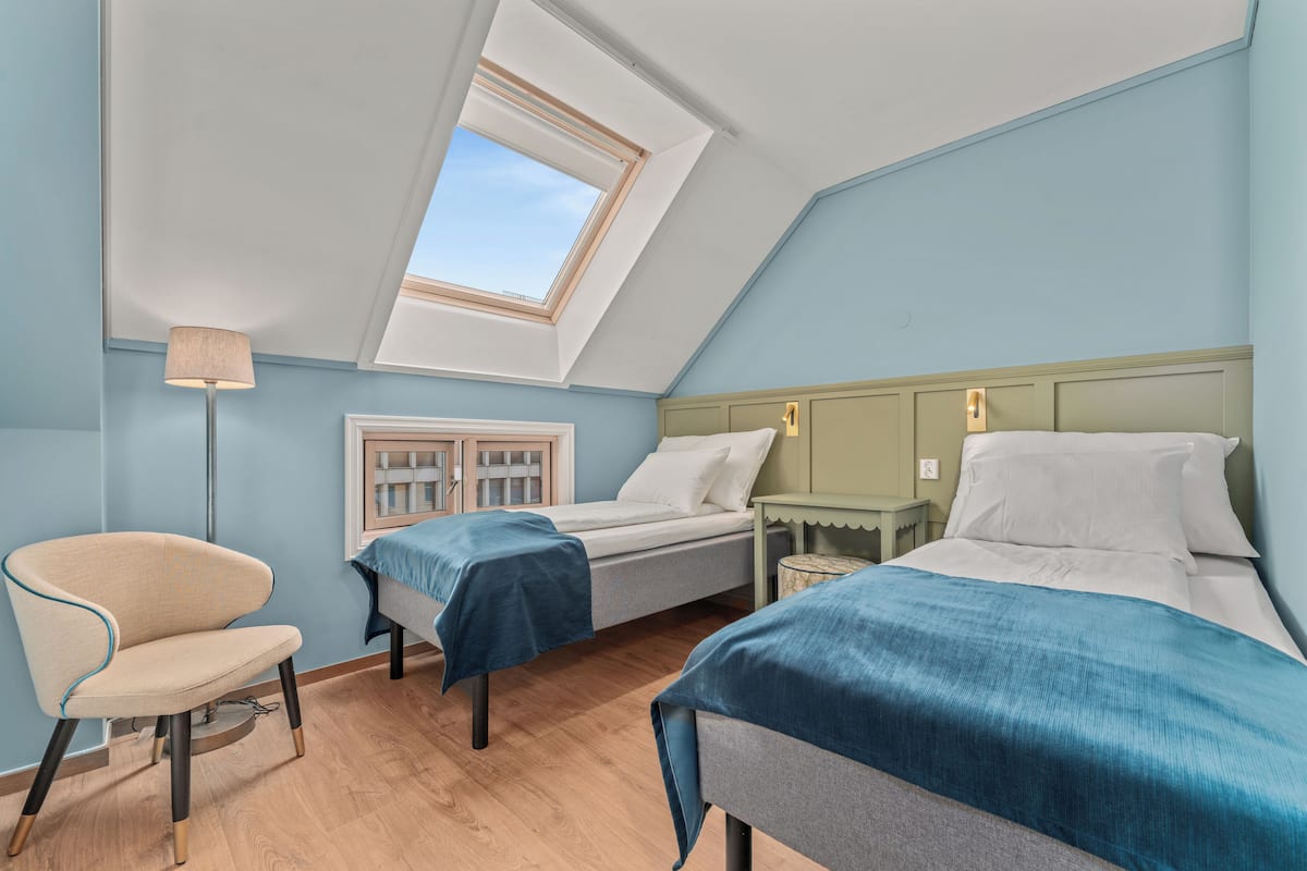 twin room | premium bedding, desk, laptop workspace, blackout curtains