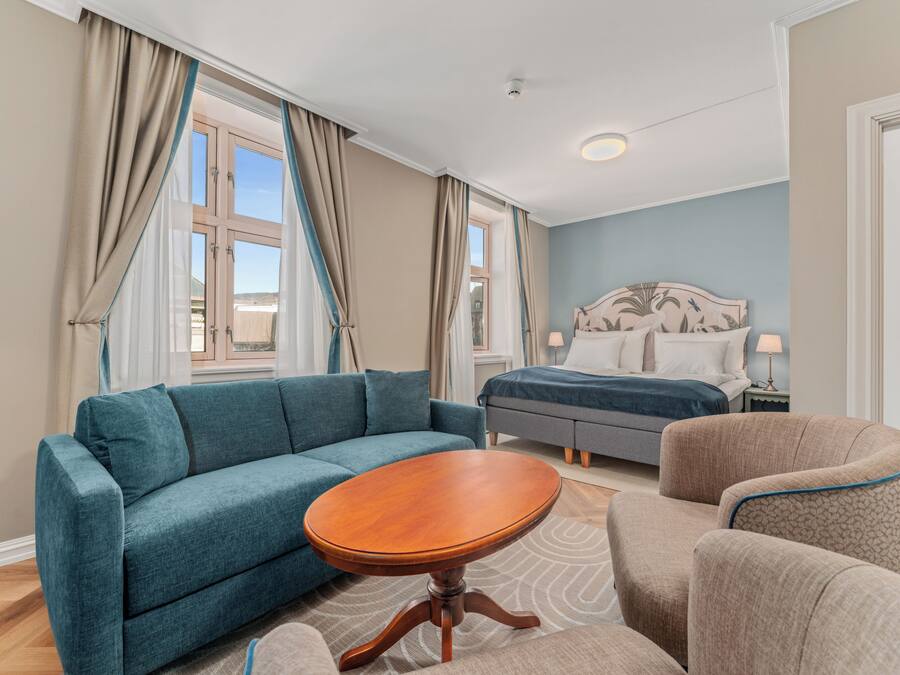 Suite | Premium bedding, desk, laptop workspace, blackout drapes