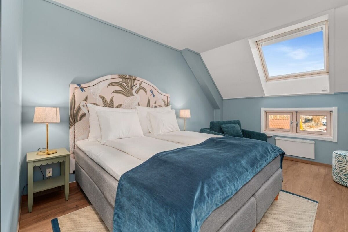 Premium bedding, desk, laptop workspace, blackout curtains