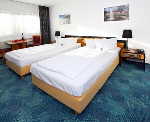 Standard Twin Room | Living area | 26-inch LCD TV with satellite channels, TV