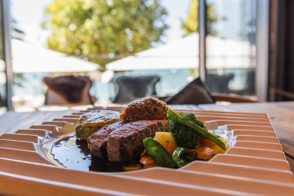 A plated meal with steak and vegetables.