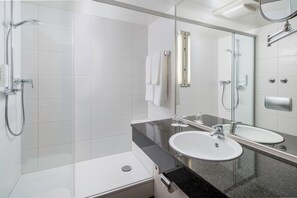 A modern bathroom with a glass-enclosed shower, two sinks, and a large mirror. - Best Western Plus Hotel Fellbach-Stuttgart (Fellbach)