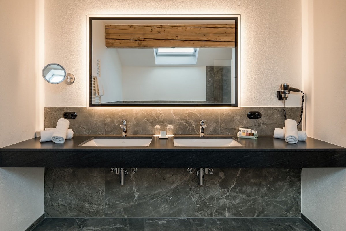 deluxe suite, 1 queen bed with sofa bed | bathroom | free toiletries, hair dryer, bathrobes, slippers