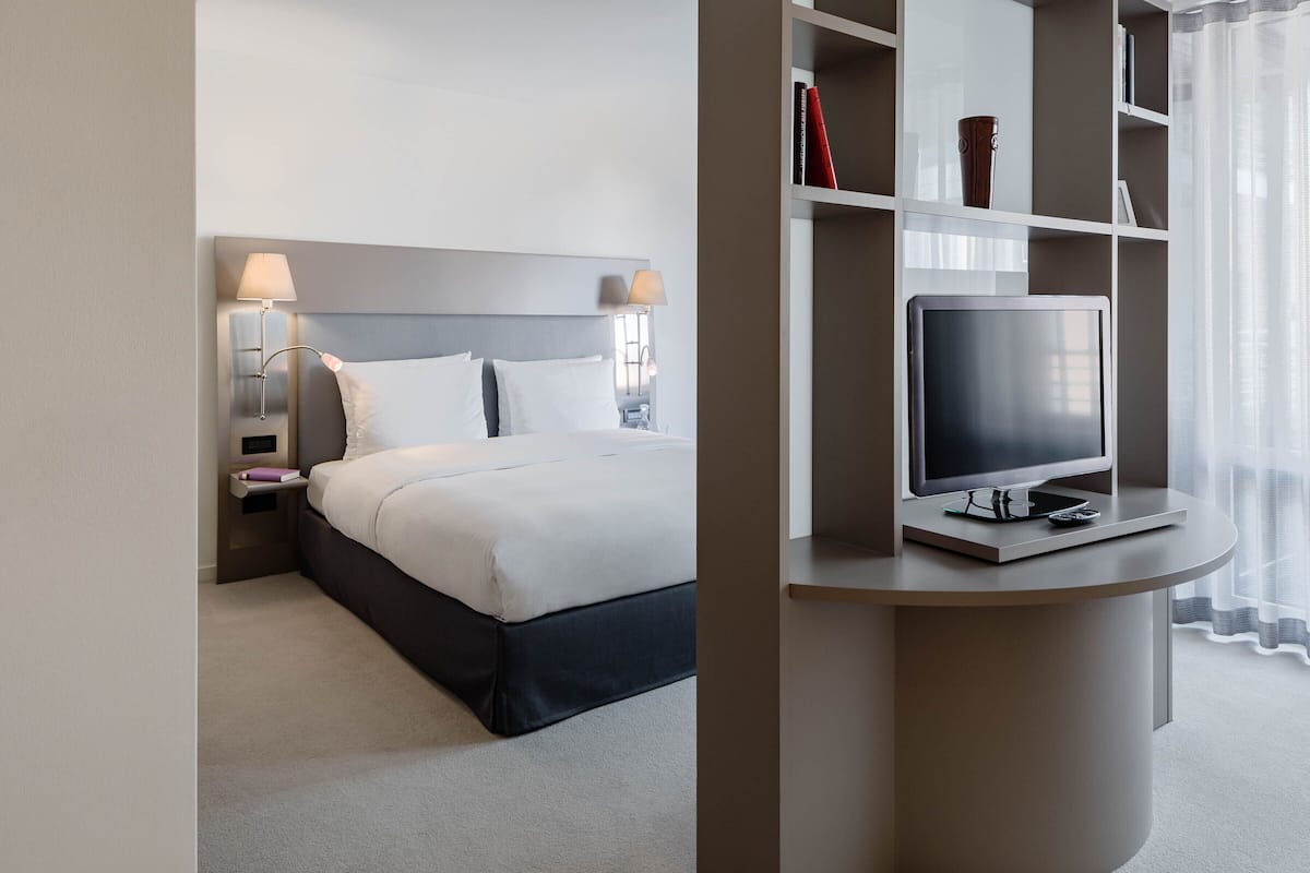 Suite (Management) | Premium bedding, down comforters, minibar, in-room safe