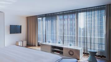 Premium bedding, down comforters, minibar, in-room safe