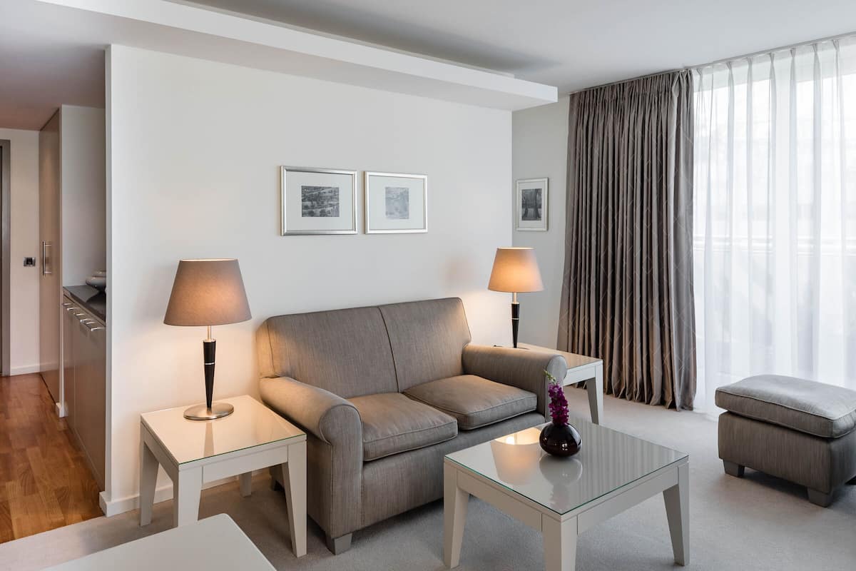 Grand Suite | Living area | 32-inch flat-screen TV with satellite channels, Netflix, DVD player