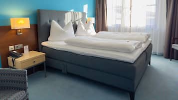 Premium bedding, down comforters, minibar, in-room safe