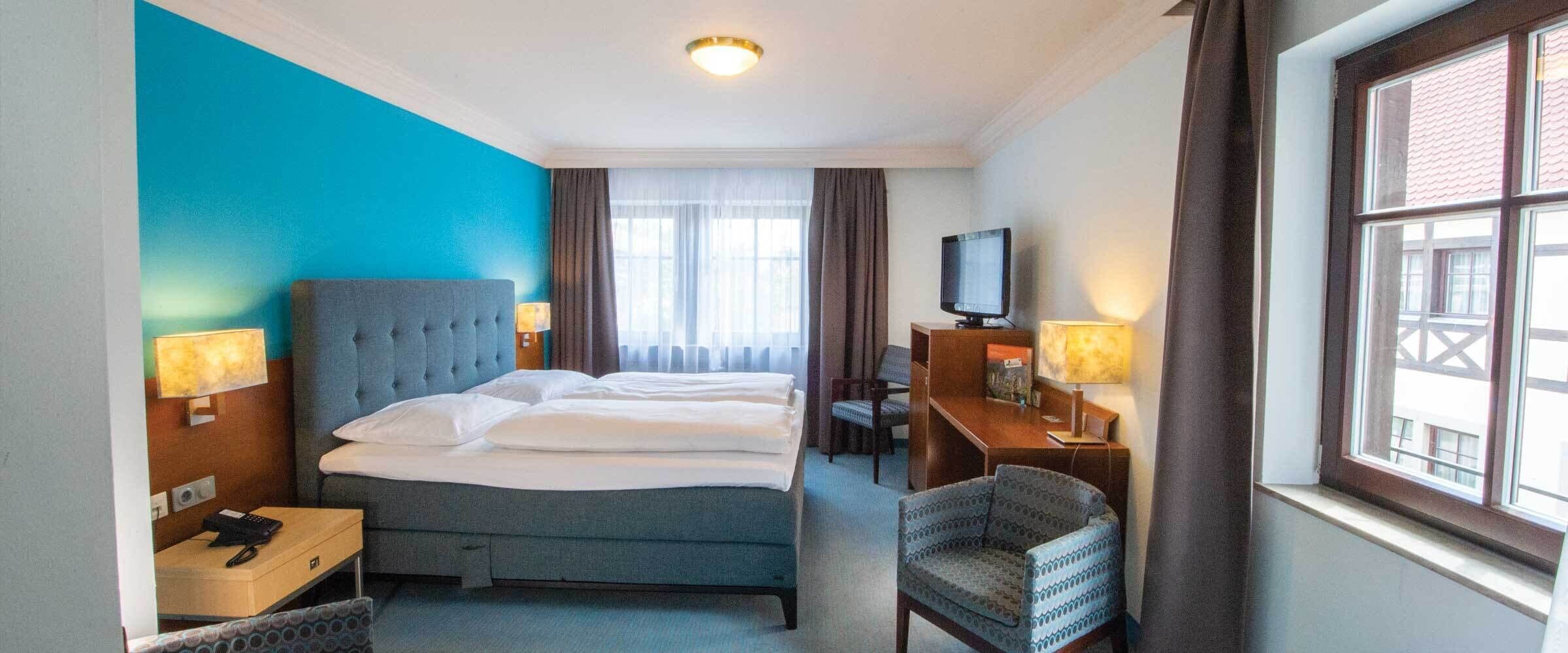 premium bedding, down duvets, minibar, in-room safe