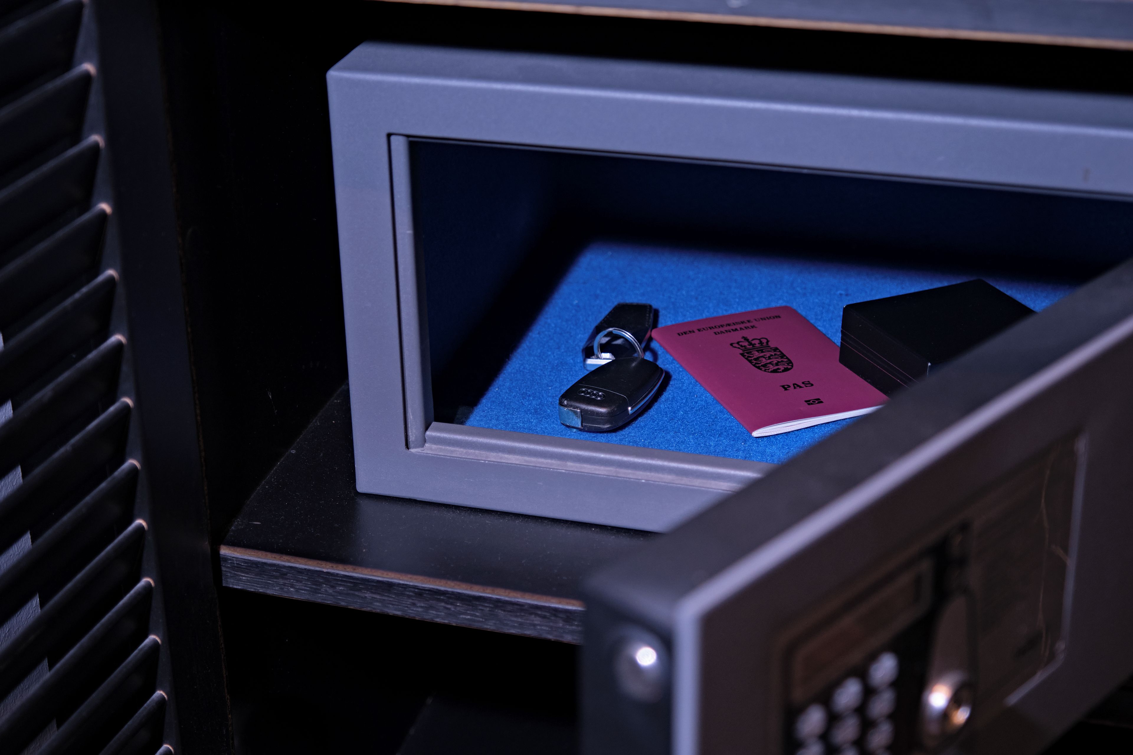 A security camera with a blue mat and a red booklet on it.