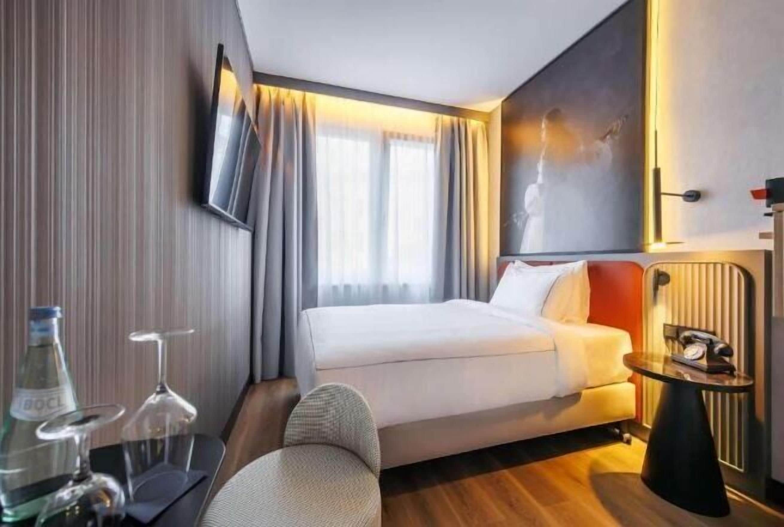 Hypo-allergenic bedding, desk, blackout drapes, soundproofing