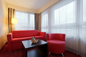 Junior Suite | Living area | Flat-screen TV