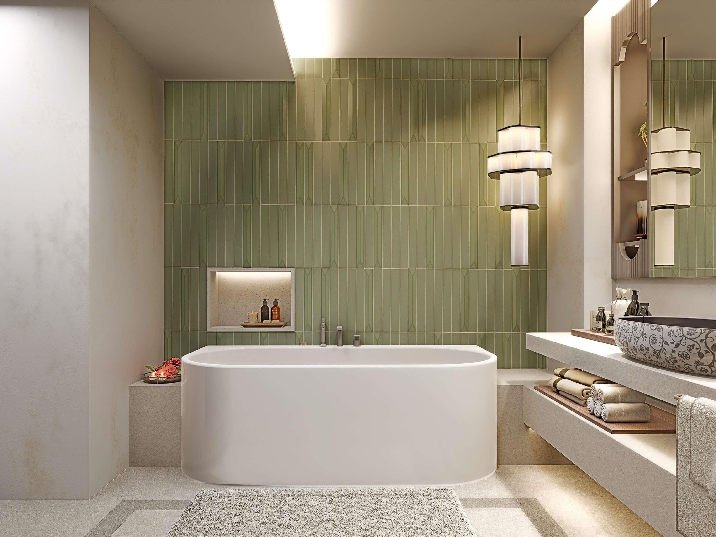 Un baño moderno con una bañera independiente, un tocador con un espejo grande e iluminación en la pared.