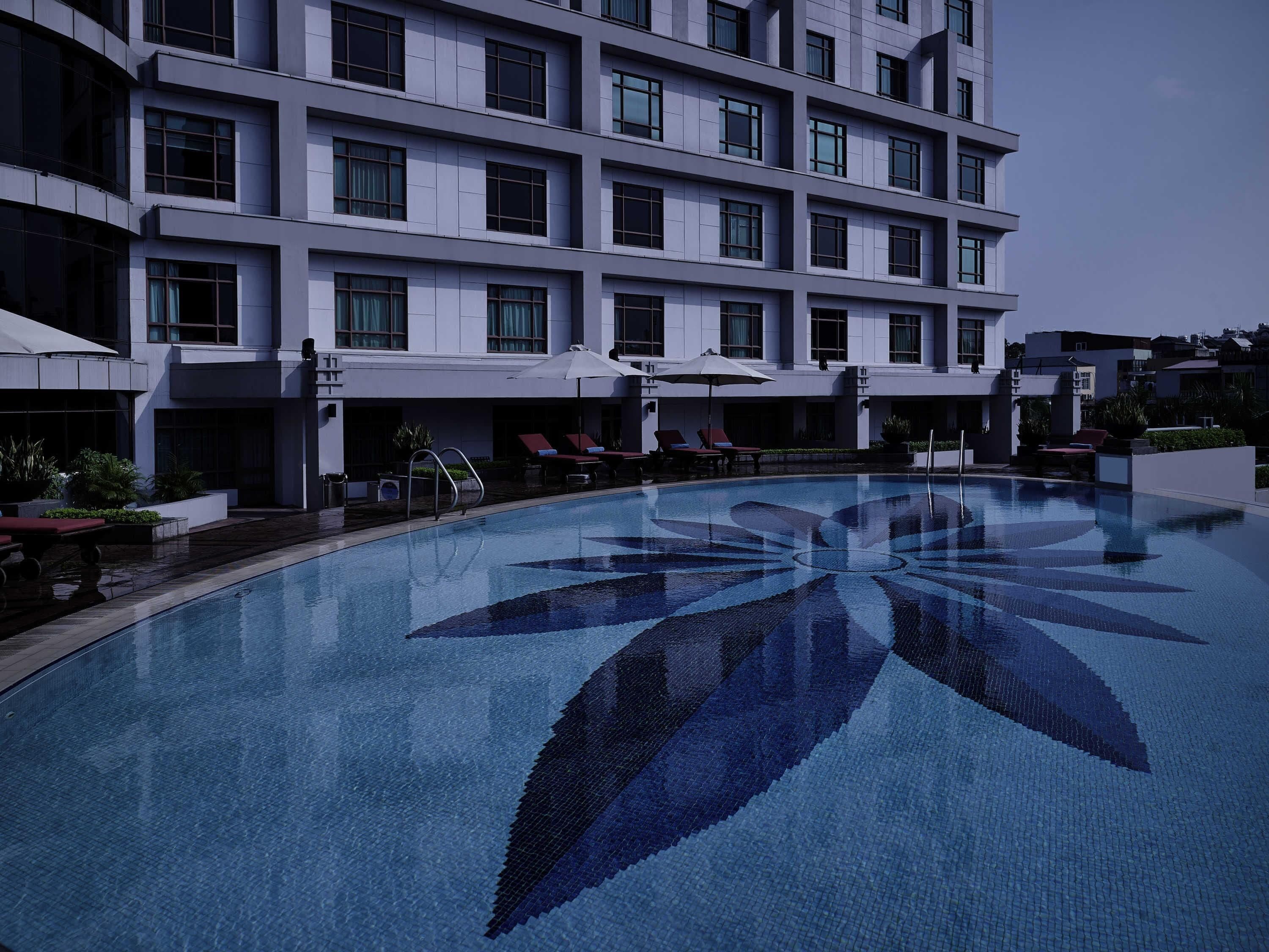 Outdoor pool, pool umbrellas, sun loungers