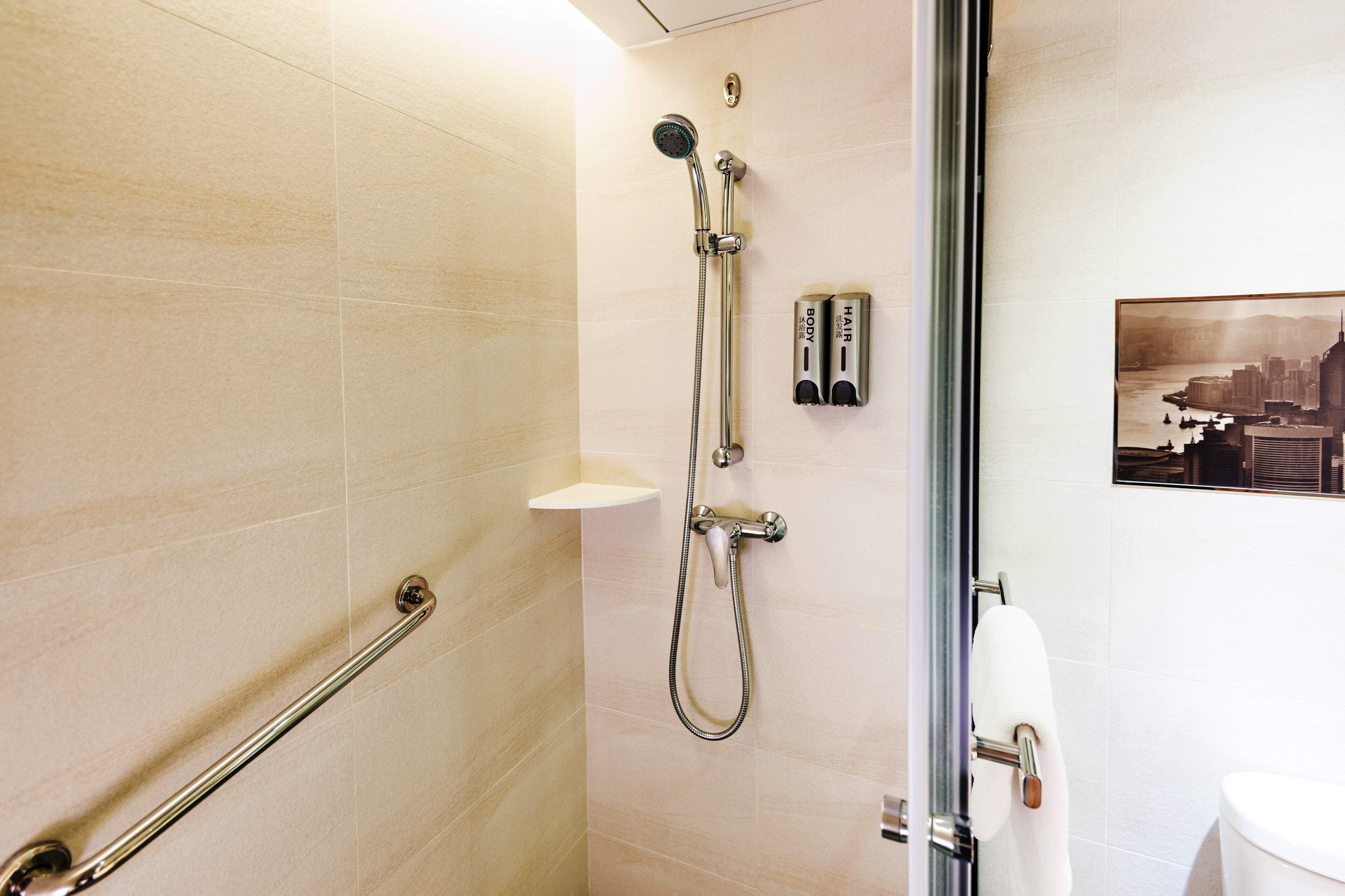 shower, hair dryer, slippers, towels