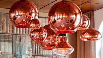 A ceiling with multiple spherical pendant lights.