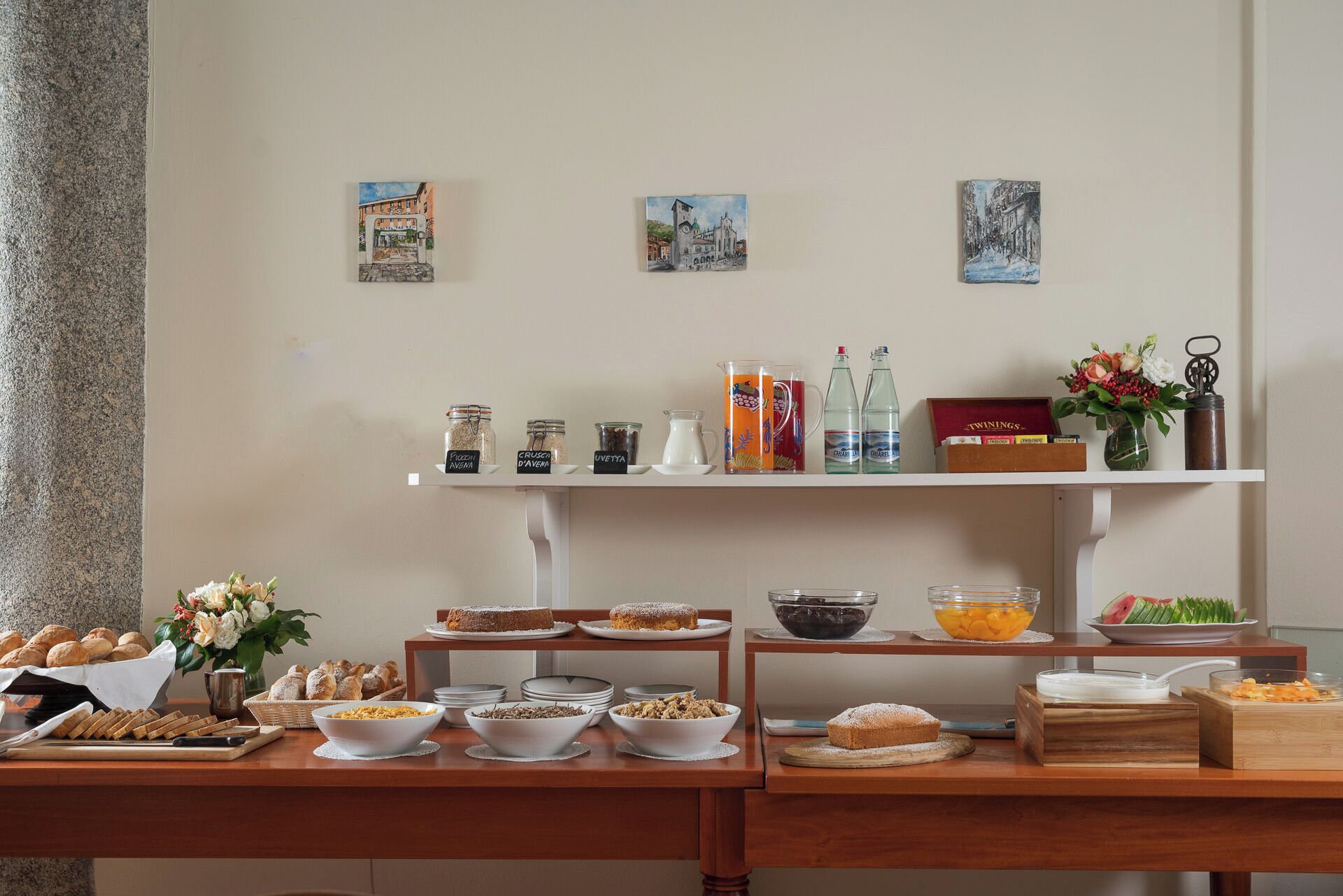 A breakfast buffet with various food items and beverages.