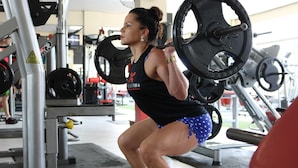 A person performing squats with a barbell in a gym setting. - Ludvika Stadshotell (Ludvika)