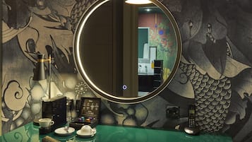 Guest rooms feature unique artistic murals and stylish decor.