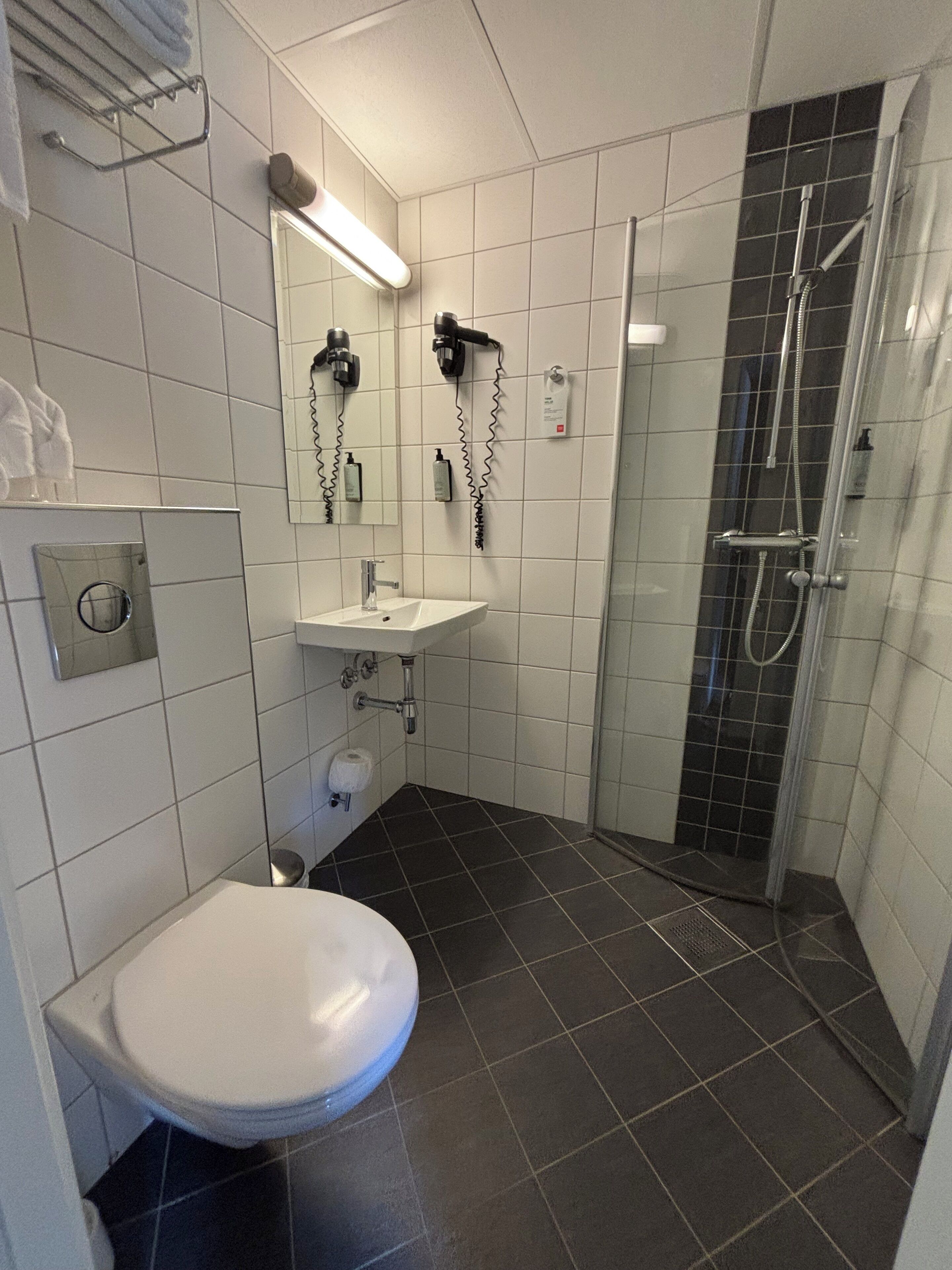 shower, hair dryer, heated floors, towels