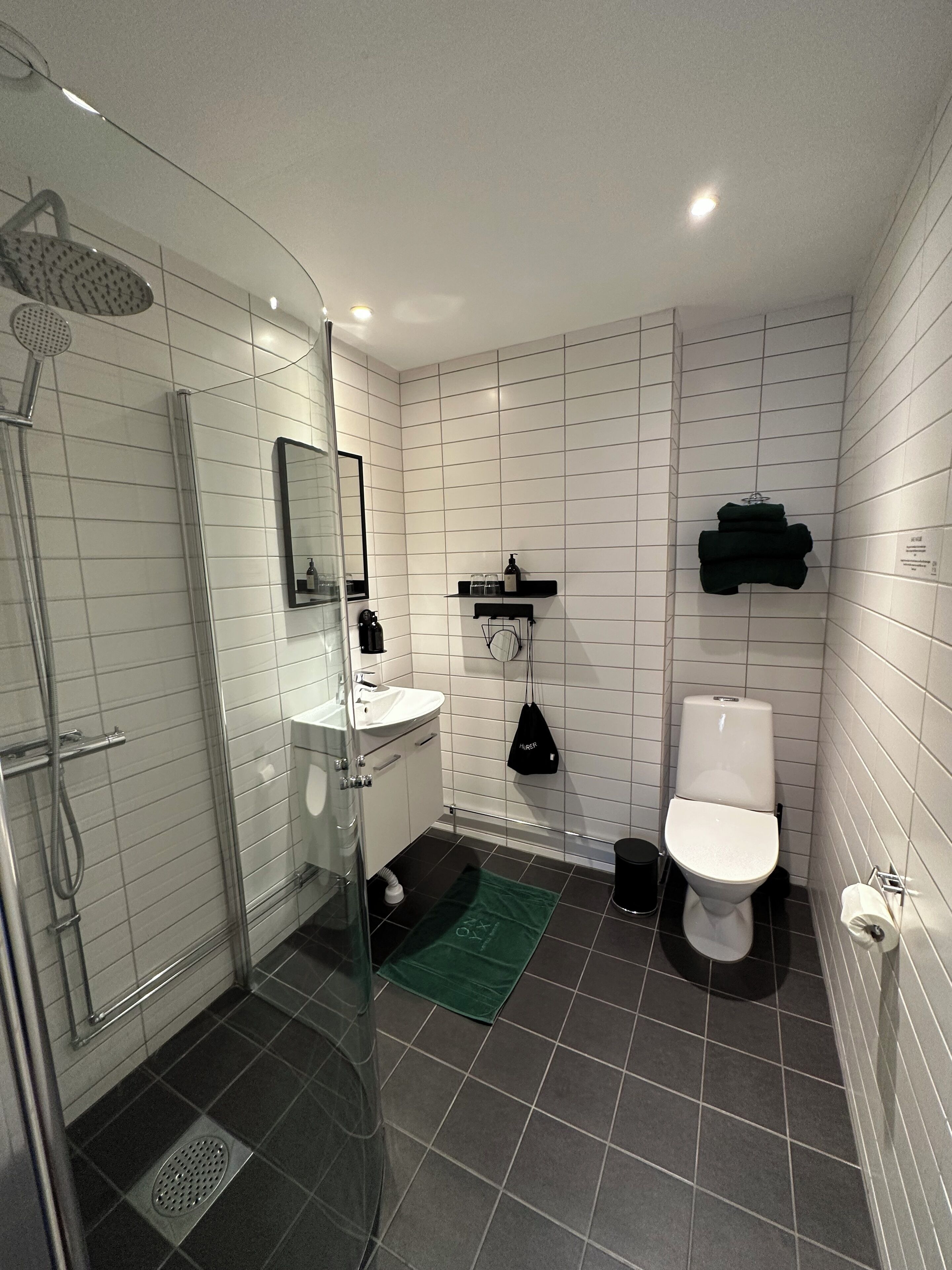 double city view | bathroom | shower, eco-friendly toiletries, hair dryer, towels