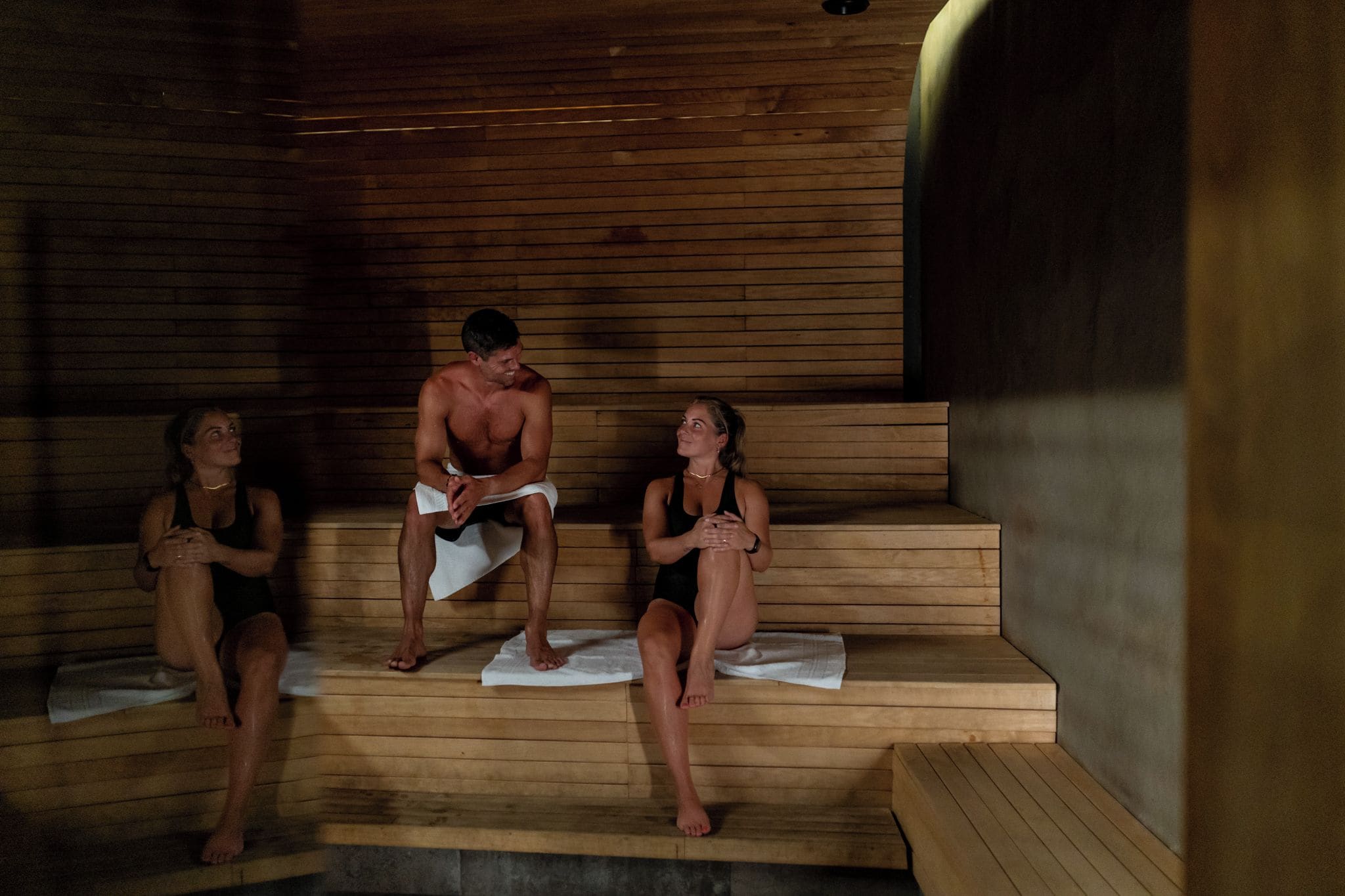 A sauna with wooden benches and benches.