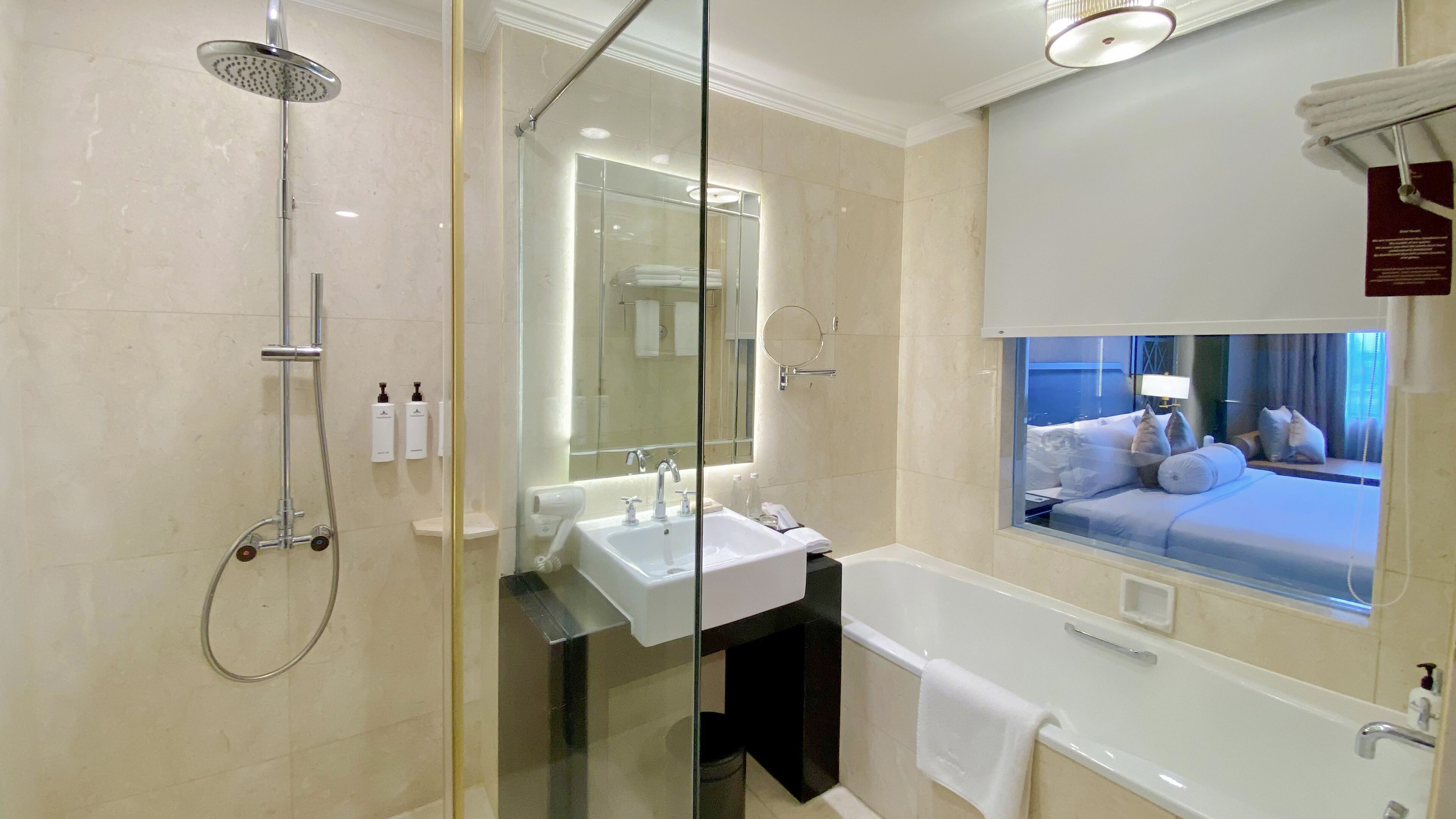 separate bathtub and shower, jetted bath, rainfall showerhead