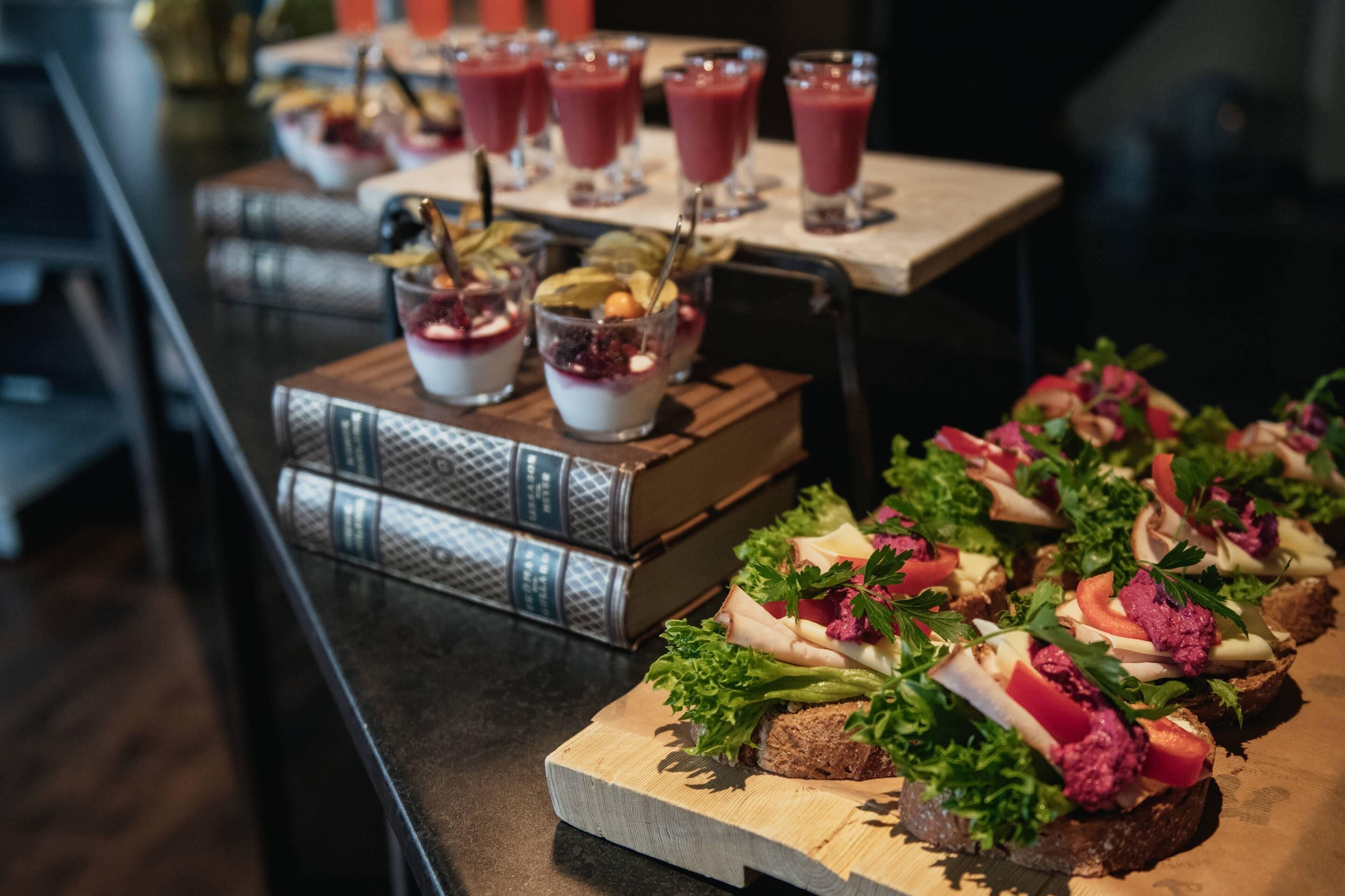 A buffet table with various food items and drinks.