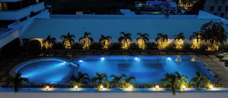 Outdoor pool, open 7:00 AM to 10:00 PM, pool umbrellas, pool loungers