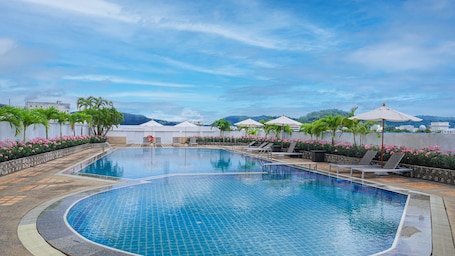 Outdoor pool, open 7:00 AM to 10:00 PM, pool umbrellas, sun loungers