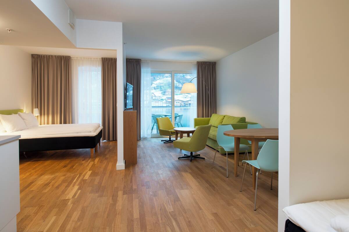 Apartment, 1 Bedroom, Ocean View | Minibar, desk, laptop workspace, blackout drapes