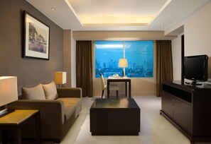 Deluxe Suite, 1 King Bed | Living room | LCD TV